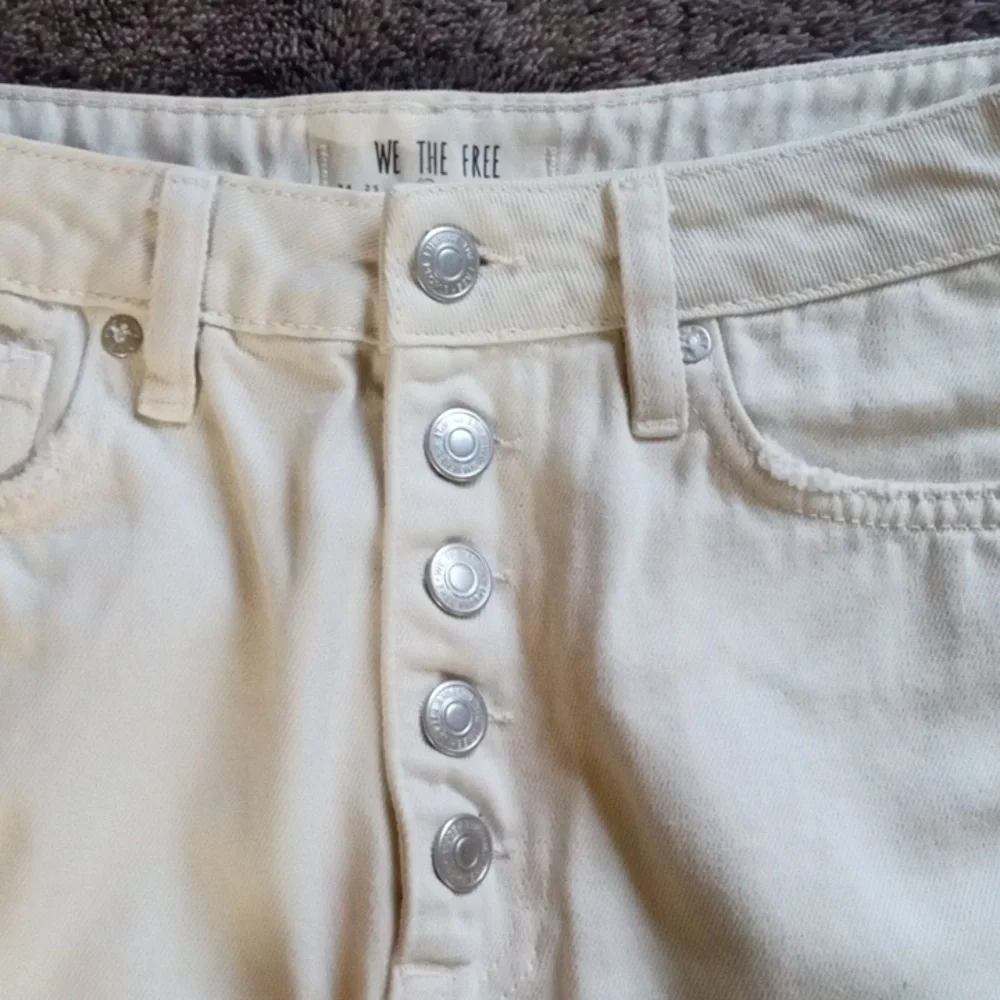 We the Free 27 waist cream colored five pocket distressed miniskirt